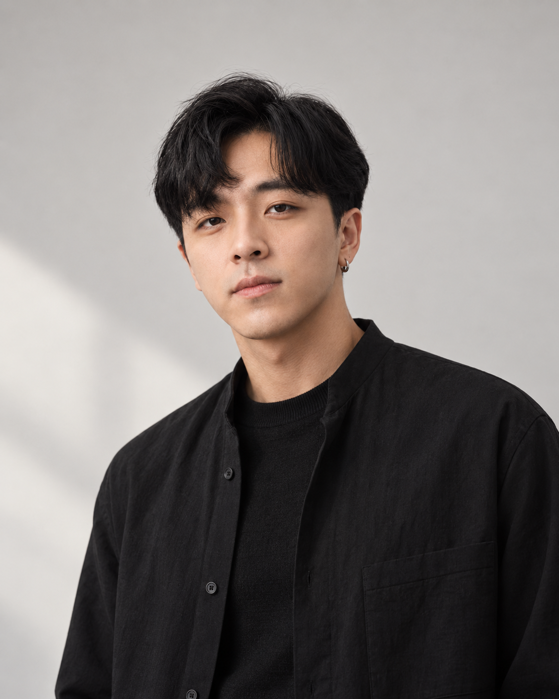 Jackson, founder of Veesi, wearing a black shirt in soft studio light.