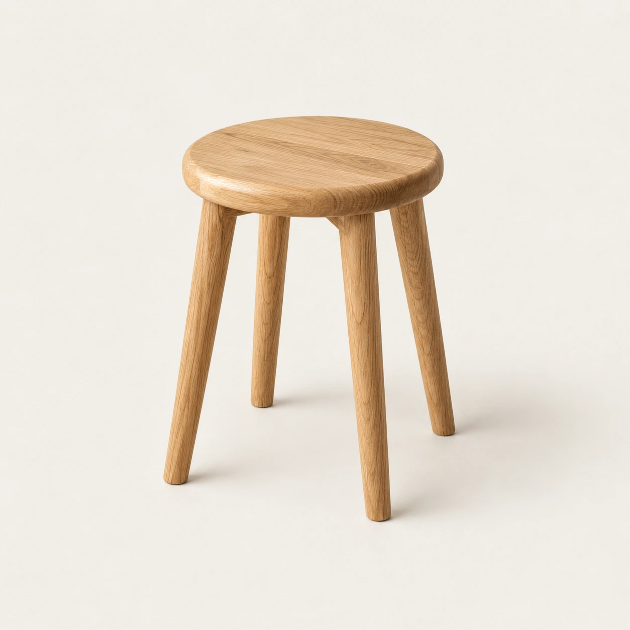 Round stool in natural oak, an illustrative concept product on a warm neutral background